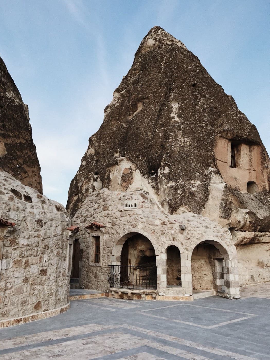 Rock-cut arches and stone facade of a Göreme cave hotel