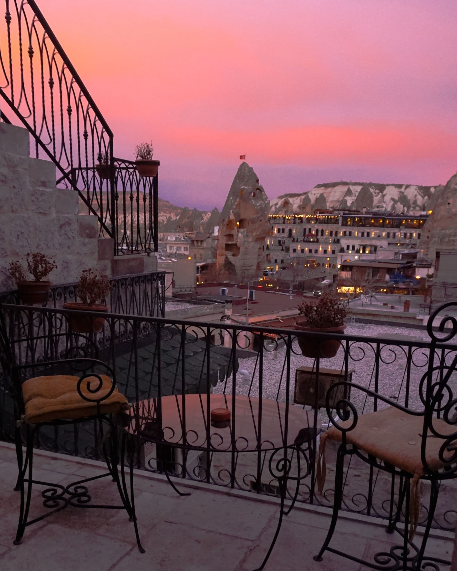 Cave hotel patio looking over the valleys at sunset