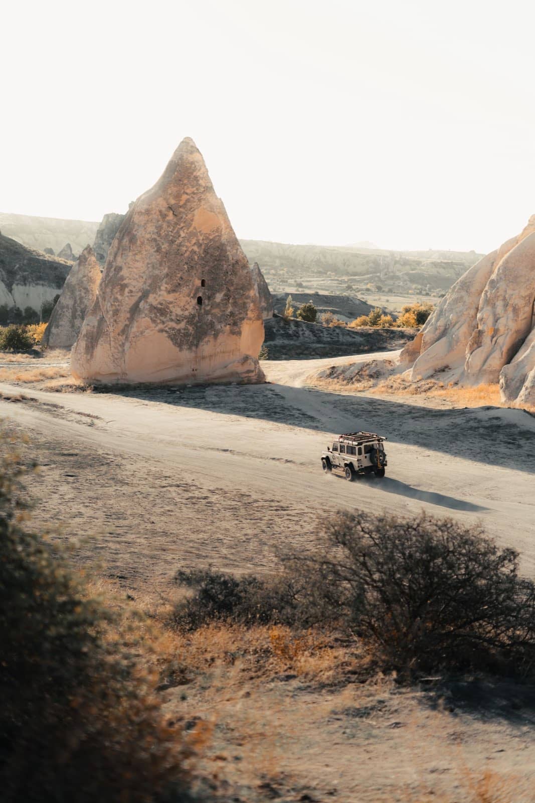 A road winding through the valleys of Cappadocia from above